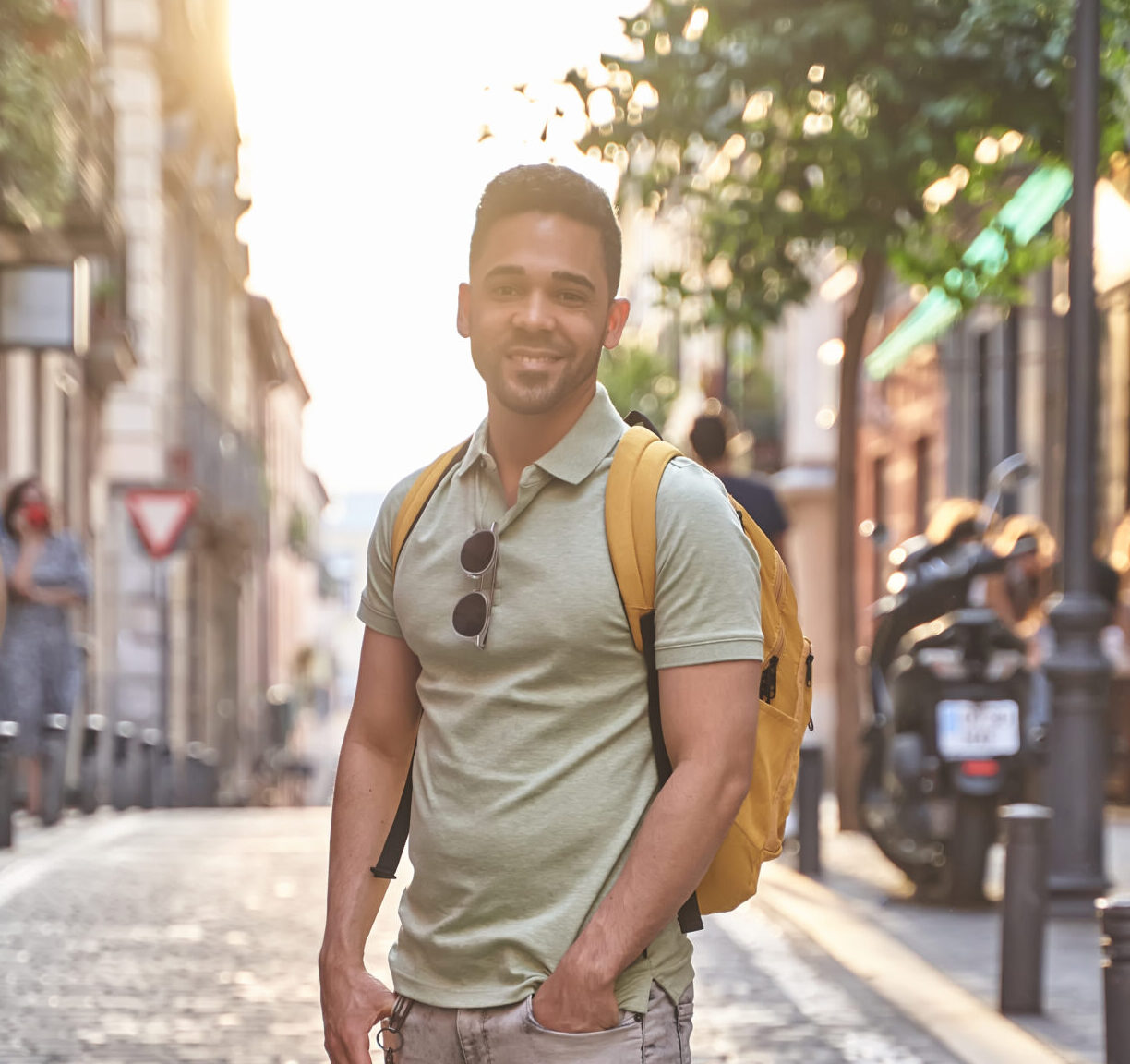 young smiling latino man walking through the stree 2023 11 27 05 23 25 utc scaled e1726700742517